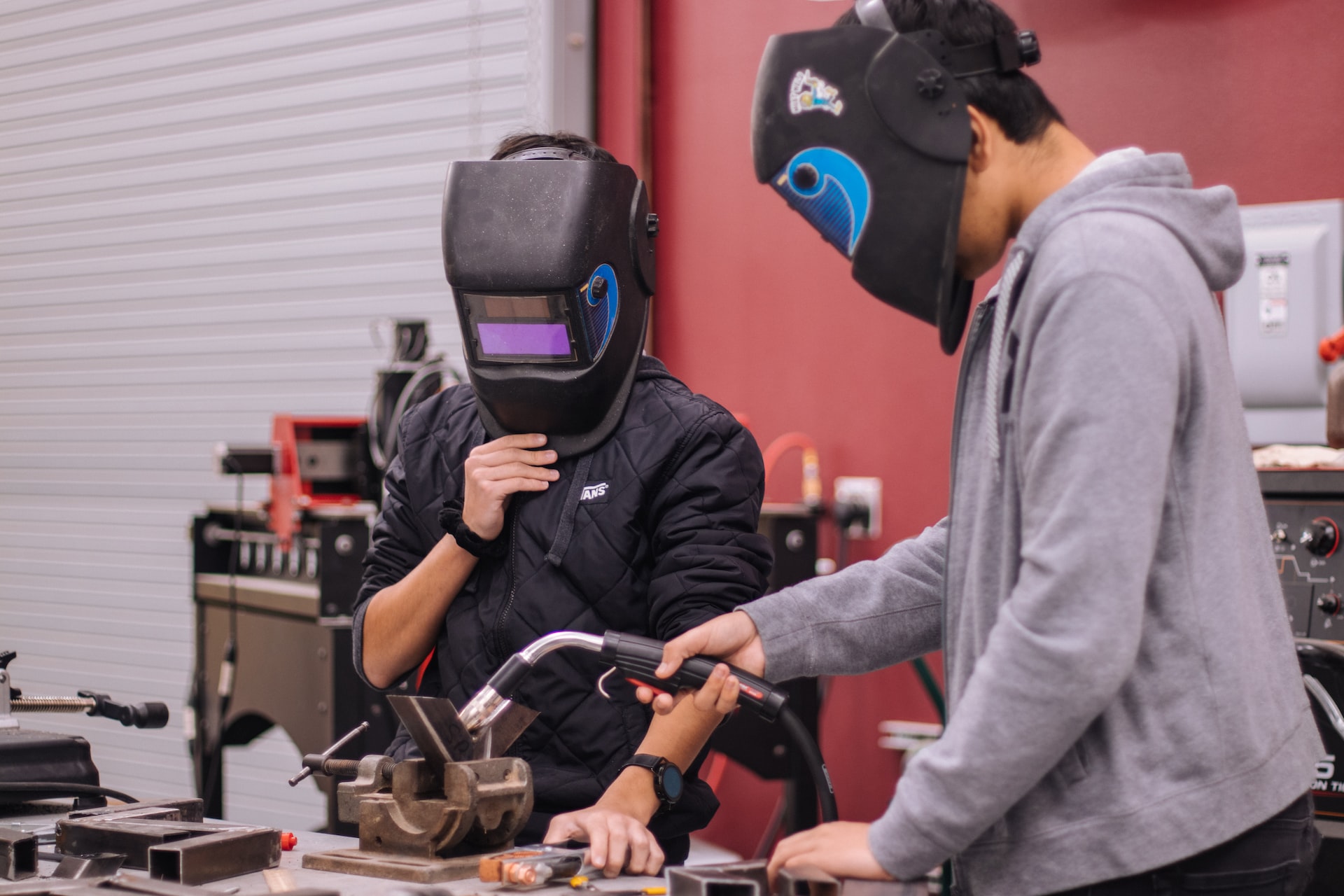 Manual arts students with blow torch.